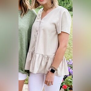 Cream peplum button top